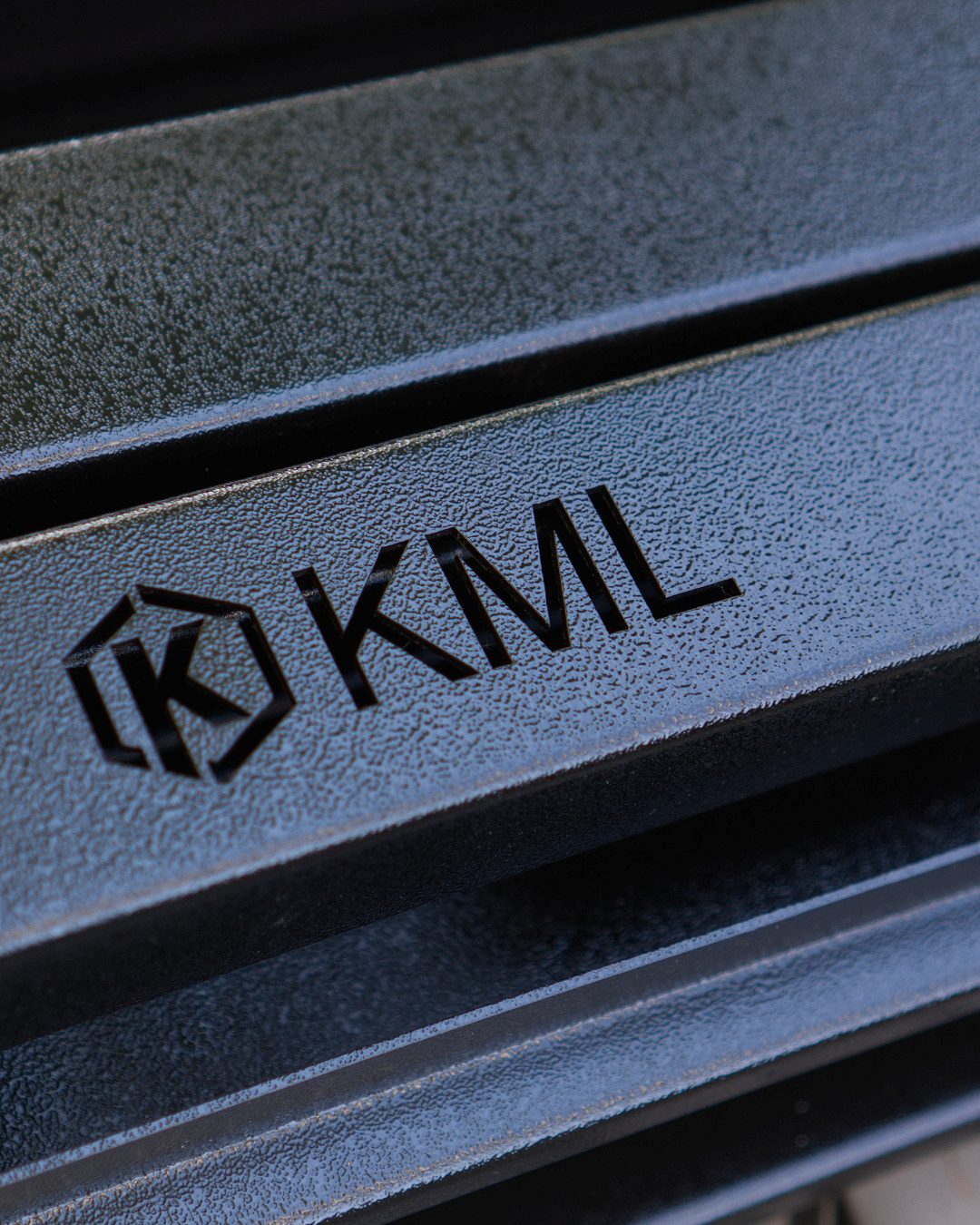 Powder-coated KML metal piece