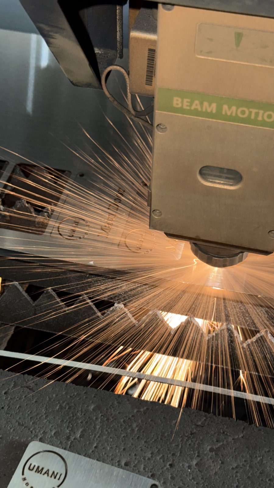 Fiber laser cutting metal with sparks