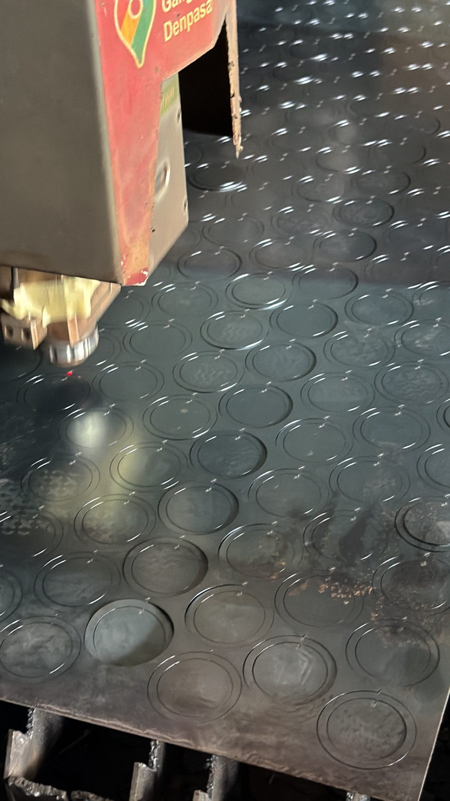 Fiber laser cutting head in operation