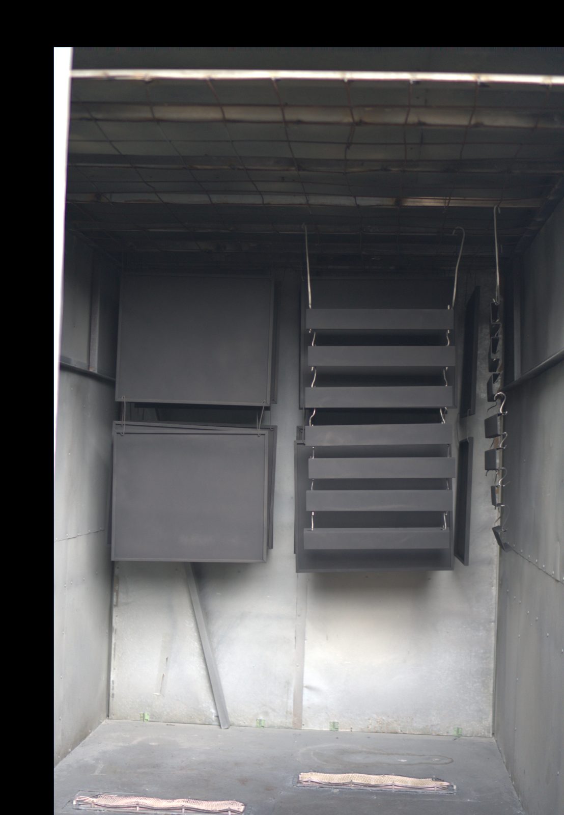 Powder coating booth with coated metal panels